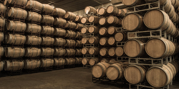 Rows of barrels stacked on racks and aging contents