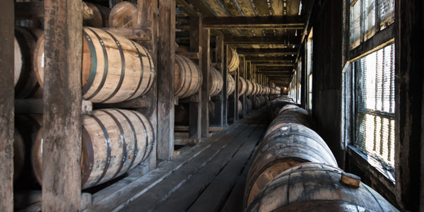 Whiskey barrels in a rickhouse