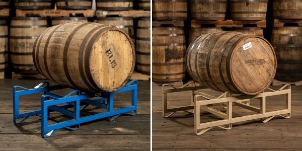 A BLiS Maple Syrup barrel on a rack on the left and a Skinny Sticks Maple Syrup barrel on a rack on the right