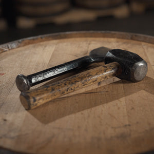 Hammer and chisel on top of barrel