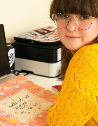 Rachel sat with a piece of textile art work