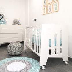 Baby room with crib and chest of drawers