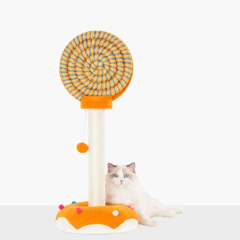 A cat beside a candy inspired scratching post in a bright colorful orange