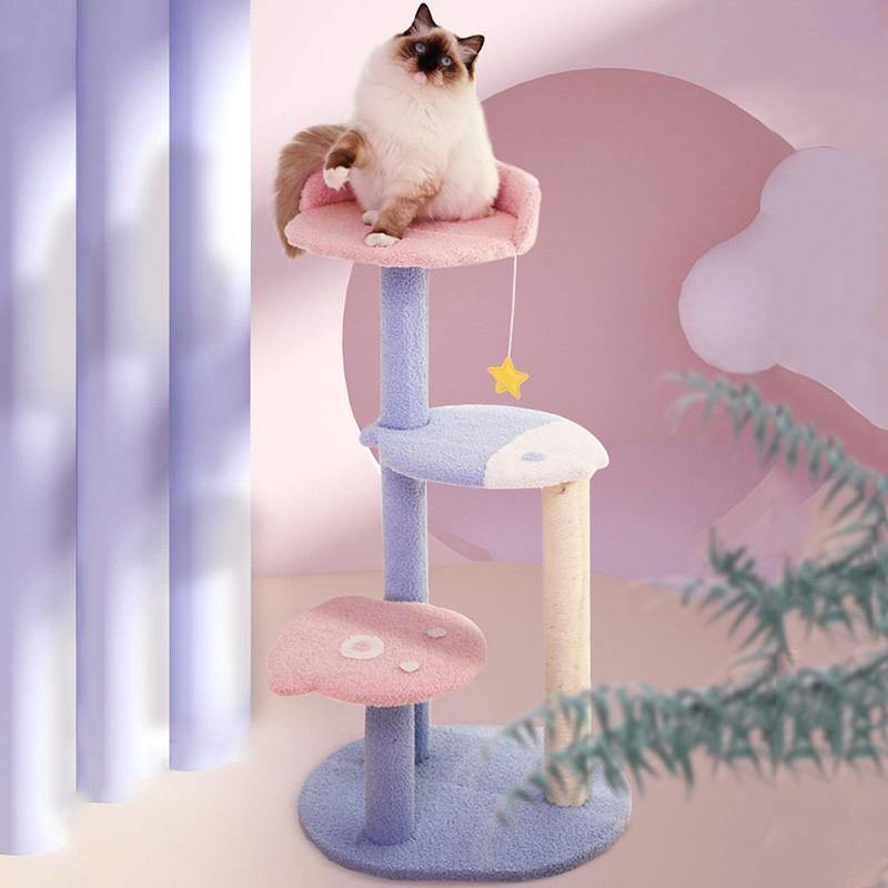 An adorable cat on top of a three level pastel pink and purple cat tree