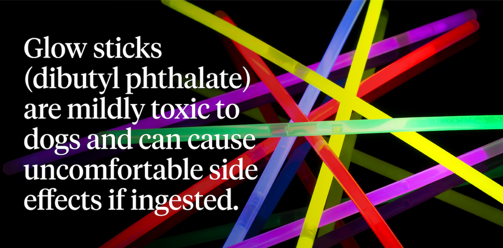 Pile of bright glow sticks on top of a black background
