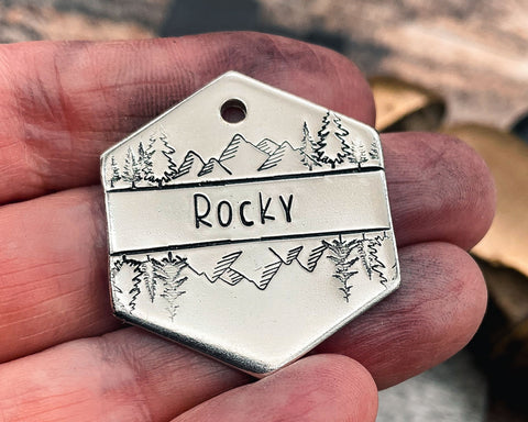 mountain dog tag with trees