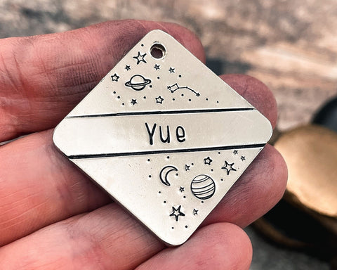 hand-stamped-galaxy dog id tag with planets and stars