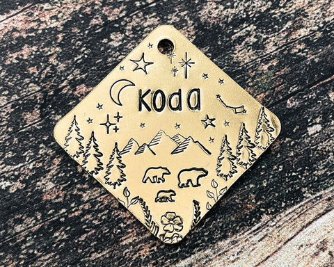 square metal dog tag with bear family and mountains