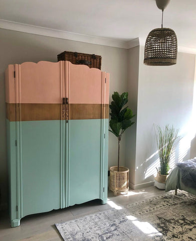 Vintage wardrobe painted in coral and mint green