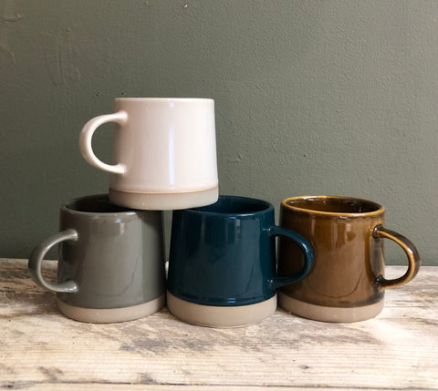 stoneware coffee cups in 4 colours brown, green, grey and beige