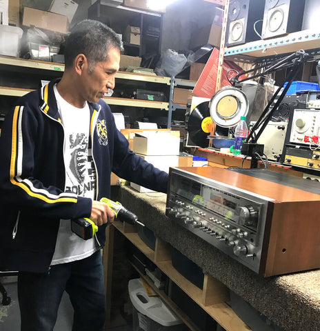 Stereo technician working on a Pioneer SX-1980