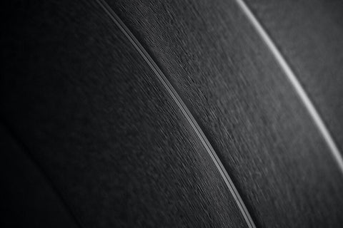 Close up of grooves in a vinyl reord.