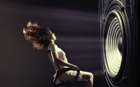 Woman in chair listening to music