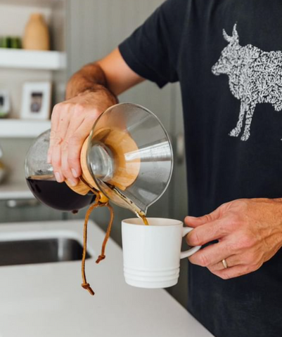 chemex coffee being poured in a cup