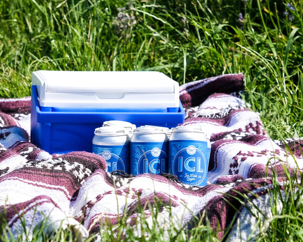cooler packed for a picnic with ice cold lagers brewed by whistle buoy brewing