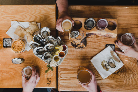 Beer and oysters enjoyed at an accessible table