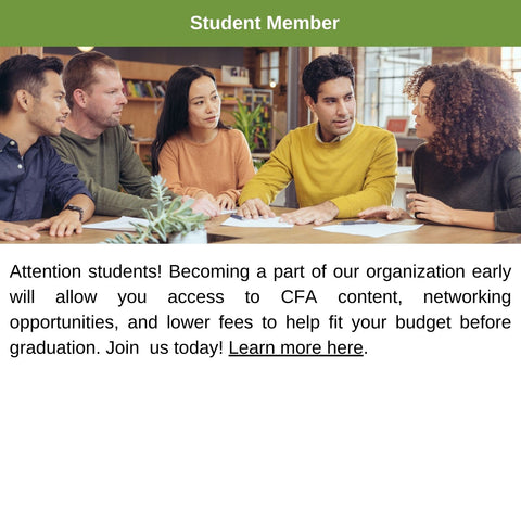 Students sitting at a table studying together.