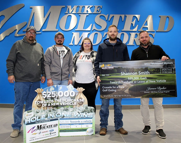 Hole in One Winner Shannon with his Prize Check