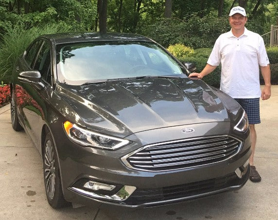 Pictured here is the lucky winner, Brad Miller, with his brand new Ford Fusion courtesy of Bill Brown Ford in Livonia, MI.