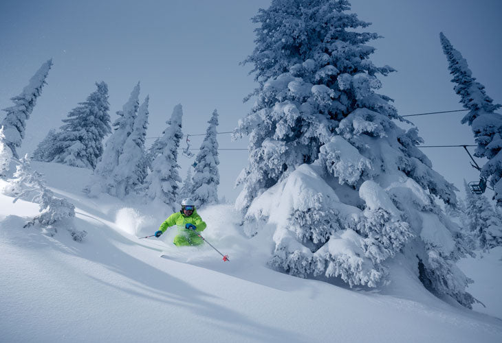 skier at Big White with Cliff Chair behind