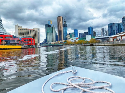 Boat sailing on the South Yarra river looking onto the Melbourne city view