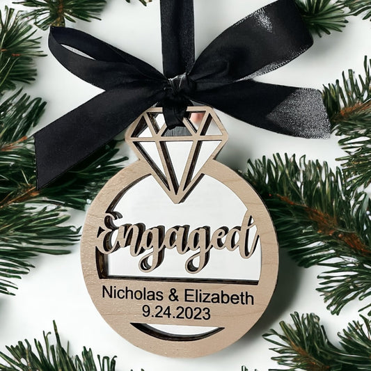 https://cdn.shopify.com/s/files/1/0536/3928/2877/products/married-engaged-christmas-ornament-keepsake-352181.jpg?v=1701743914&width=533