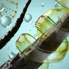 Imagen mustra la hebra capilar de un cabello, rodeada de una especie de sustancia verde como componente principal de la keratina