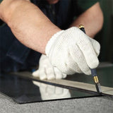 hands wearing white gloves with tool and ruler above plexiglass