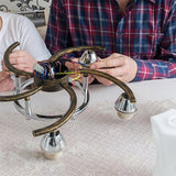 person in plaid shirt repairing lamp