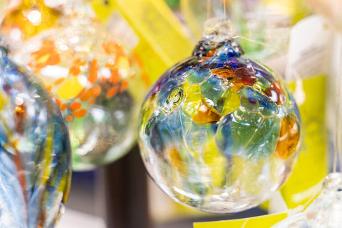 Alt="Yellow and blue glass ball ornament gifts"