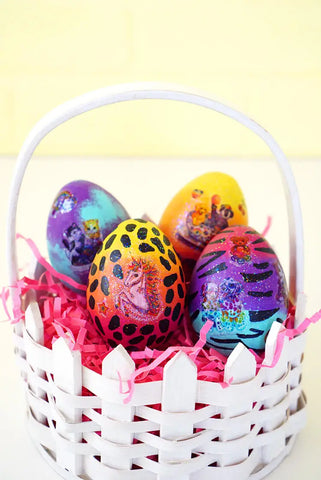 A white basket full of brightly coloured eggs