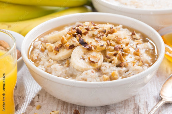 Bright photo of oatmeal with natural fruits in a bowl, one of the best high protein vegan snacks.
