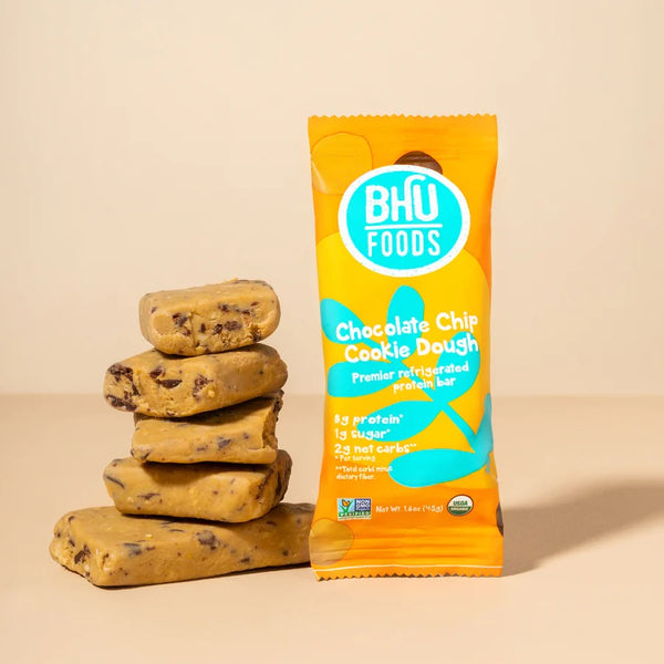Bhu Foods Low Sodium Protein Bars stacked in bite sized pieces beside a wrapper.