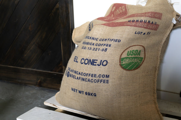 An organic coffee bag from Honduras.  Organic coffee production means cleaner beans, land, and water, resulting in healthier soil and ecosystems, as well as a better cup of coffee for consumers. 