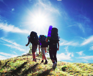 group backpacking up a hill