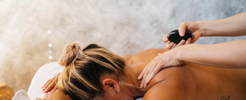 Closeup of middle aged woman getting back massage in peaceful environment