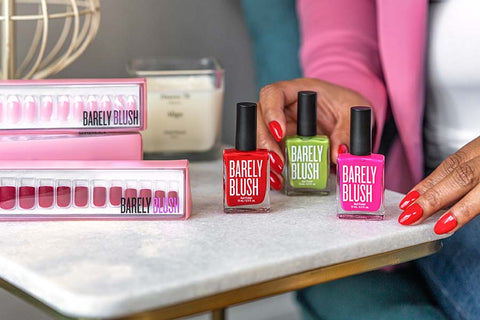 Closeup shot of Philishea Everage, owner of Barely Blush luxury nail care line, with products from her shop