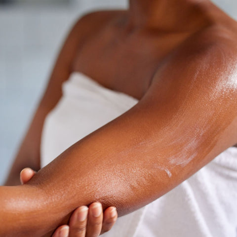 woman applying body butter