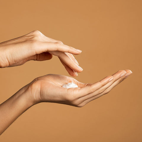 hand holding body butter