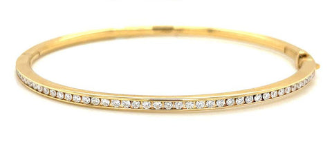 Yellow gold and diamond classic channel bangle