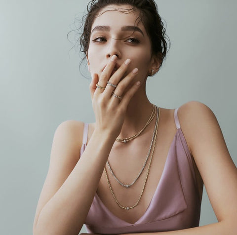 Woman wearing Fope necklaces