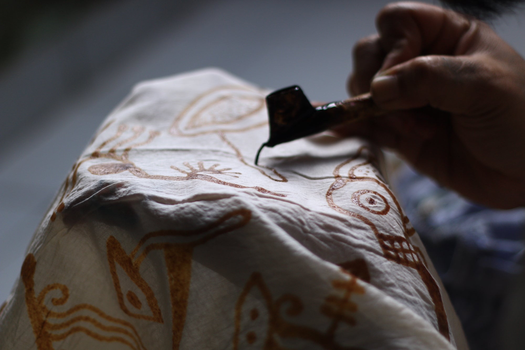 Artist Arwin Hidayat works on a Batik print.