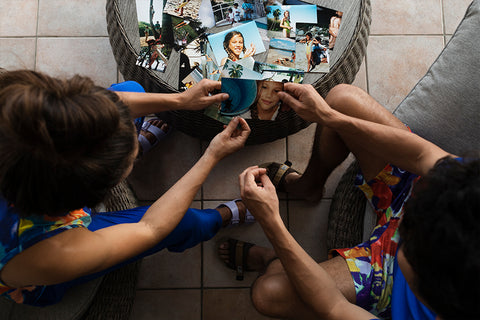 Justine and her brother, Theo, looking through old family photographs.