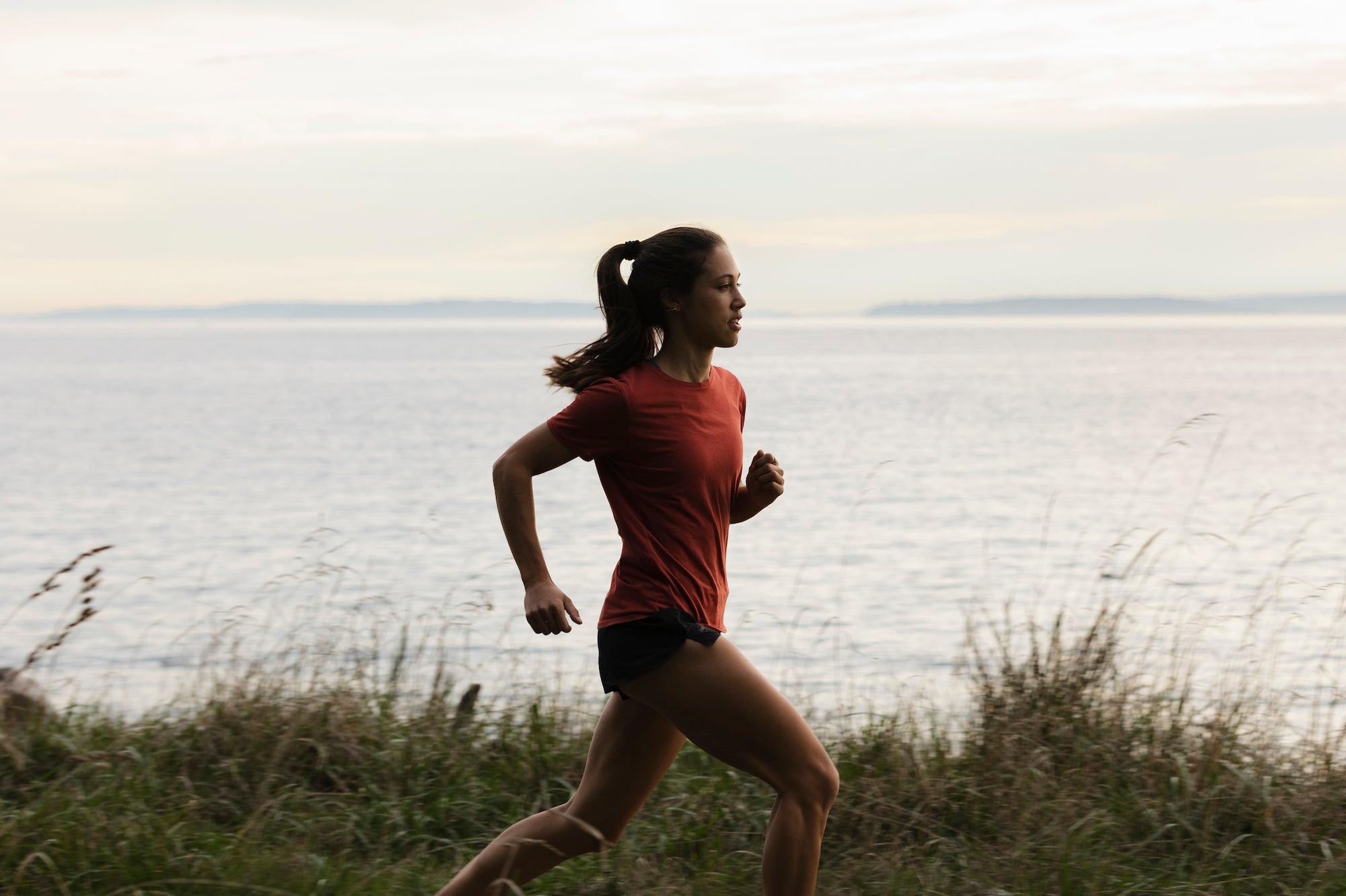 Justine runs along the coast