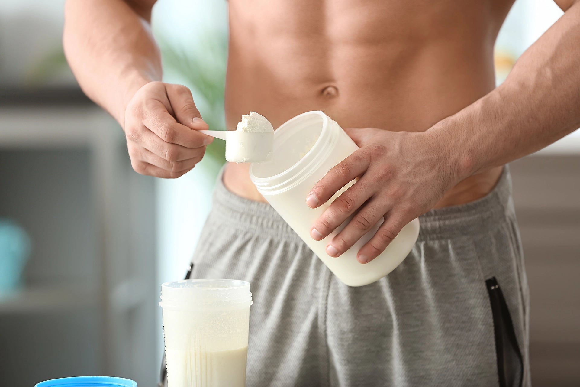 Sporty Guy Making a Protein Shake