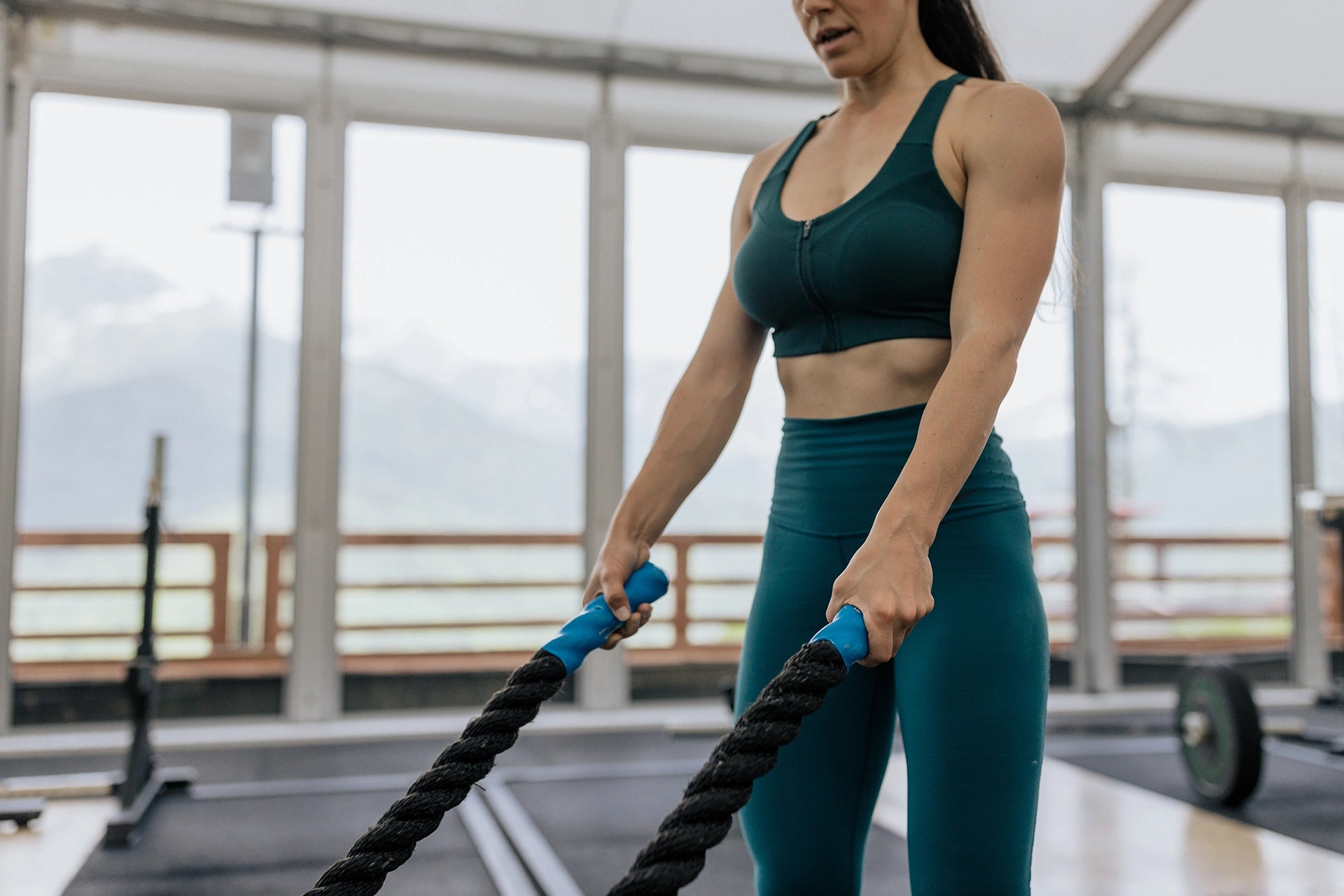 Woman Working Out - Using Battle Ropes