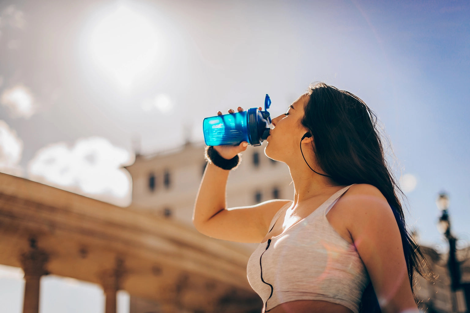 Woman sipping from a shaker