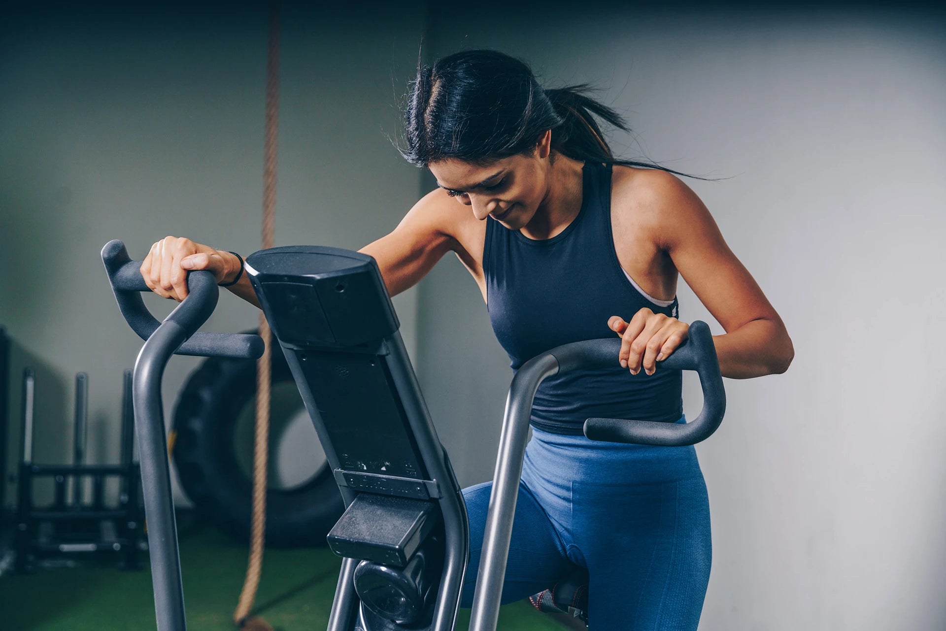 Women Exercising On Bike