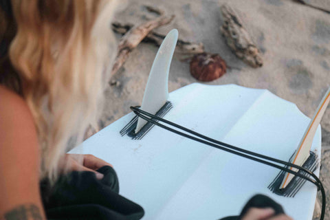 A close-up of a surfboard tail