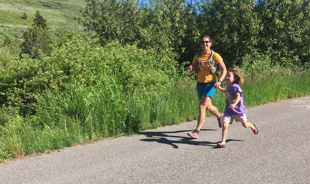 Amy Hatch at the Scout Mountain Ultra Trail 50 mile race finish with daughter